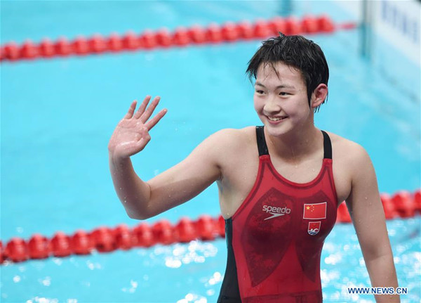 Li Bingjie of Hebei reacts after the women's 400m freestyle swimming final at 13th Chinese National Games in north China's Tianjin Municipality, Sept. 1, 2017. Li Bingjie won the gold medal with 4 minutes and 01.75 seconds. (Xinhua/Ju Huanzong)