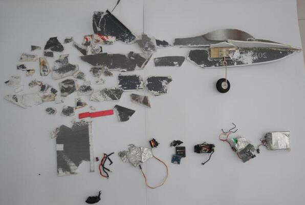 The model plane is shattered into pieces after being hit by the high-speed train.