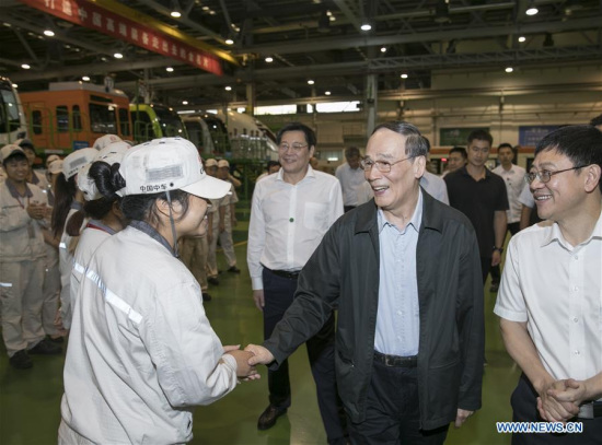 Wang Qishan, head of the Communist Party of China Central Commission for Discipline Inspection, inspects CRRC Zhuzhou Locomotive Co., Ltd. in Zhuzhou City, central China's Hunan Province, Sept. 4, 2017. Wang Qishan made an inspection tour in Hunan Province from Sept. 3 to 5. (Xinhua/Wang Ye)