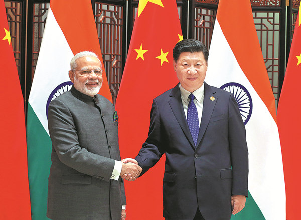 President Xi Jinping meets with Indian Prime Minister Narendra Modi on Tuesday at the BRICS Summit. (WU ZHIYI / CHINA DAILY)