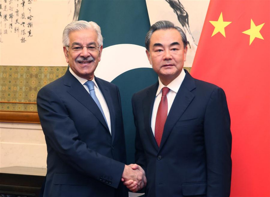 Chinese Foreign Minister Wang Yi (R) shakes hands with Pakistani Foreign Minister Khawaja Asif in Beijing, capital of China, Sept. 8, 2017. (Xinhua/Yao Dawei)