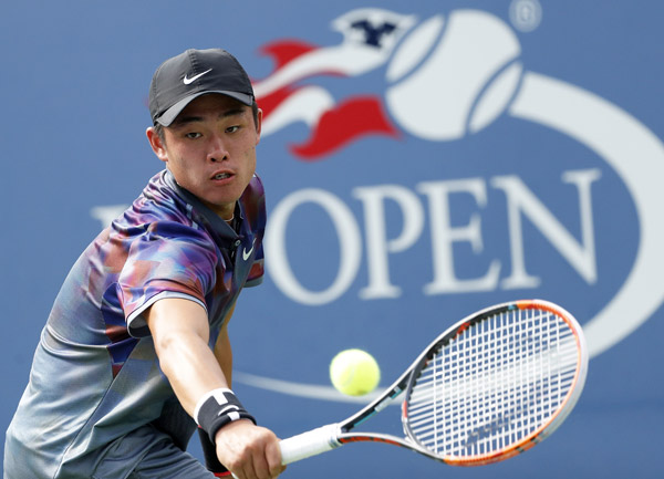 Wu Yibing, 17, became China's first boys' Slam singles champ by defeating Argentina's top-seeded Axel Geller on Sunday. (Photo/Xinhua)