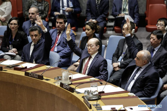 Liu Jieyi (C, Front), China's permanent representative to the United Nations, votes in favor of a Security Council resolution to impose fresh sanctions on the Democratic People's Republic of Korea (DPRK) over its latest nuclear test, at the UN headquarters in New York, on Sept. 11, 2017. (Xinhua/Li Muzi)