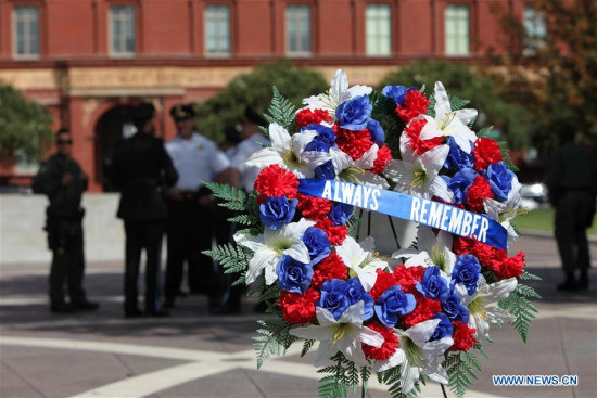 Law enforcement officers gather at the National Law Enforcement Officers Memorial to mark the 16th anniversary of the Sept. 11, 2001 terror attacks in Washington D.C., the United States, on Sept. 11, 2017. (Xinhua/Yang Chenglin)