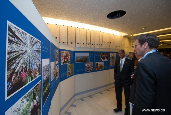 People visit a photo exhibition titled For a Better Life of the People at the Palaise des Nations in Geneva, Switzerland, on Sept. 11, 2017. The photo exhibition titled For a Better Life of the People showcasing China's progress and achievements in the human rights promotions in the recent years opened on Monday at the Palaise des Nations, the UN headquarters in Geneva. (Xinhua/Xu Jinquan)