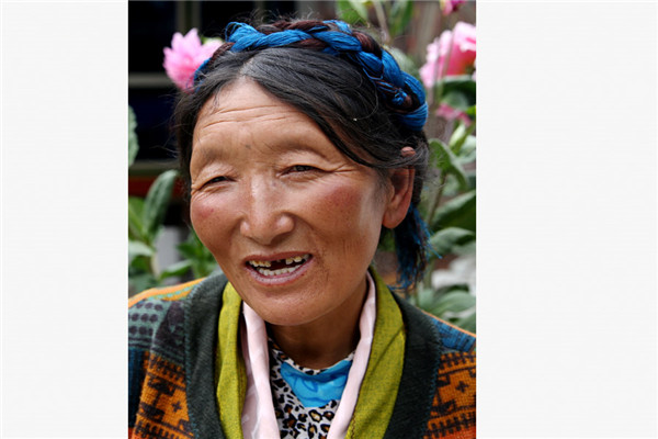 Tsamjo Drolma's family of four was registered as impoverished last year by the Lhunze county government in the Tibet autonomous region. The 49-year-old mother explained to China Daily some of the subsidies her family receives as a result. (Photo/China Daily)