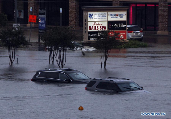 Vehicles are submerged in flood in great Houston area, Texas, the United States, Aug. 27, 2017 as the Hurricane Harvey made its strong landfall over the Texas Gulf Coast Friday night. (Xinhua/Song Qiong)