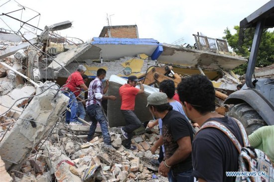 Volunteers remove debris of a collapsed building in Jojutla, state of Morelos, Mexico, on Sept. 20, 2017. (Xinhua/Armando Solis)