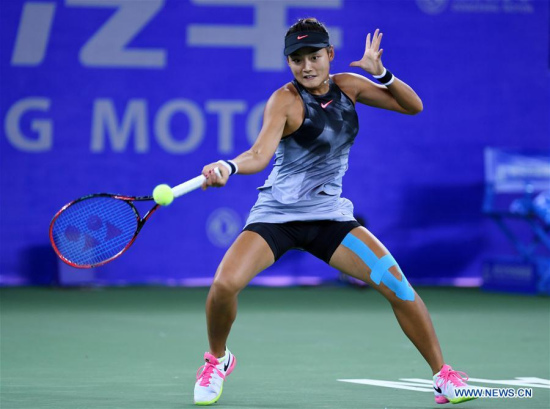 Wang Yafan of China returns the ball during the singles' first round match against Sorana Cirstea of Romania at 2017 WTA Wuhan Open in Wuhan, capital of central China's Hubei Province, on Sept. 24, 2017. Wang lost 0-2. (Xinhua/Li Ga)