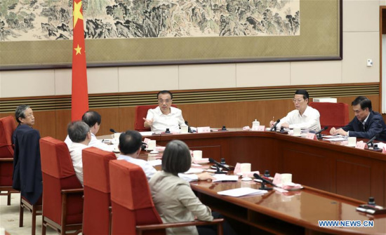 Chinese Premier Li Keqiang chairs a symposium on the reform of replacing business taxes with value-added tax (VAT), in Beijing, capital of China, Sept. 28, 2017. Chinese Vice Premier Zhang Gaoli also attended the symposium. (Xinhua/Ma Zhancheng)