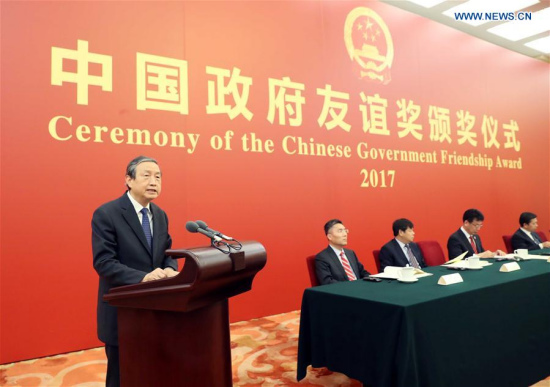 Chinese Vice Premier Ma Kai speaks at a ceremony where the Chinese government confers its Friendship Award on 50 foreign experts from 21 countries working in China, in recognition of their contribution to China's development, in Beijing, capital of China, Sept. 29, 2017. (Xinhua/Liu Weibing)