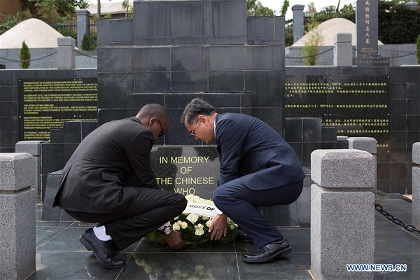 Chinese Ambassador to Rwanda Rao Hongwei (R) and Theophile Rurangwa, Director of Asia and Australasia Unit at the Rwandan Foreign Ministry, lay a wreath at the monument of the ten Chinese aid workers who died when working in aid projects for Rwanda at the Chinese martyrs' cemetery in Rulindo district, Rwanda, on Sept. 30, 2017. The Chinese embassy in Rwanda, Chinese community and representatives of the Rwanda government on Saturday paid tribute to ten fallen Chinese aid workers here. (Xinhua/Gabriel Dusabe)