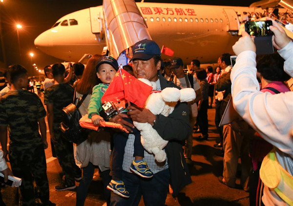 Chinese nationals arrive at Shanghai Hongqiao International Airport in Shanghai, east China, Oct. 1, 2017. Sheltered in Antigua and Barbuda after Hurricane Maria had devastated the Caribbean island of Dominica, 377 Chinese boarded two chartered planes of China Eastern Airlines on Sept. 30 and arrived in Shanghai on Sunday. (Xinhua/Ding Ting)