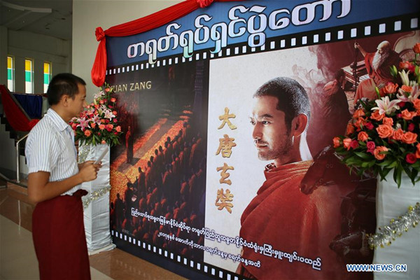 A man takes a look at the poster of Chinese movie Xuan Zang in Nay Pyi Taw of Myanmar on Oct. 1, 2017. Chinese Film Festival 2017 kicked off at the Aungthabyay Cinema in Myanmar's capital of Nay Pyi Taw on Sunday, with two Chinese movies -- Xuan Zang and Kung Fu Yoga depicting the religion and culture of China. (Xinhua/U Aung)