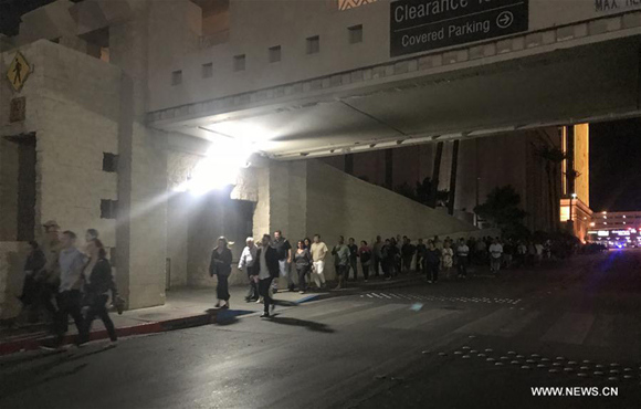 People evacuate after the shooting in Las Vegas, the United States, Oct. 2, 2017. At least 50 people were killed and over 200 others wounded in a mass shooting at a concert Sunday night outside of the Mandalay Bay Hotel in Las Vegas in the U.S. state of Nevada. (Xinhua/Huang Chao)