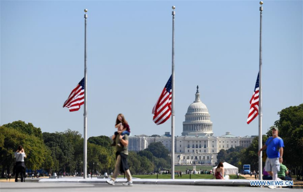 U.S. national flags fly at half mast near the Capitol Hill to mourn the victims of a mass shooting at a concert in Las Vegas, in Washington D.C., the United States, on Oct. 2, 2017. (Xinhua/Yin Bogu)