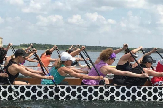 Participants in the  dragon boat during competition /Photo via Texas Dragon Boat Association