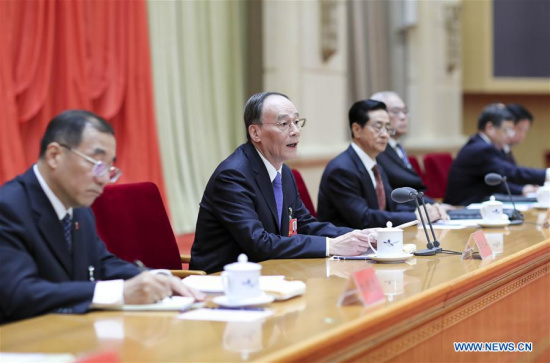 Wang Qishan (2nd L), a member of the Standing Committee of the Political Bureau of the Communist Party of China (CPC) Central Committee and secretary of the CPC Central Commission for Discipline Inspection (CCDI), addresses the Eighth Plenary Session of the 18th CCDI of the CPC in Beijing, capital of China, Oct. 9, 2017. (Xinhua/Ding Lin)