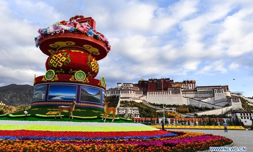 Flower decorations are set to greet the National Day in front of the Potala Palace in Lhasa, capital of southwest China's Tibet Autonomous Region, Sept. 30, 2017. China's National Day falls on Oct. 1. (Xinhua/Purbu Zhaxi)