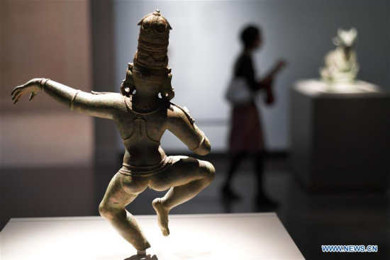 A visitor views artworks from India at the Freer Gallery of Art in Washington D.C., the United States, on Oct. 11, 2017. (Xinhua/Yin Bogu)