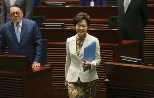 Hong Kong's Chief Executive Carrie Lam Cheng Yuet-ngor steps up to deliver her first Policy Address on Wednesday. (Photo by Roy Liu/China Daily)