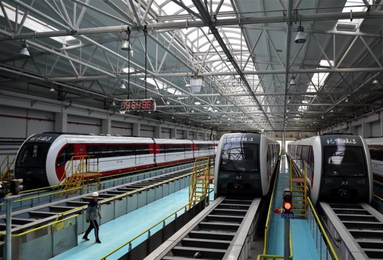 Photo taken on Oct. 16, 2017 shows maglev trains at the garage in Beijing, capital of China. Beijing's first medium-low speed maglev line is expected to start trial operation by the end of this year. The 10.2-km S1 line will connect the western suburban districts of Mentougou and Shijingshan. (Xinhua/Zhang Chenlin)