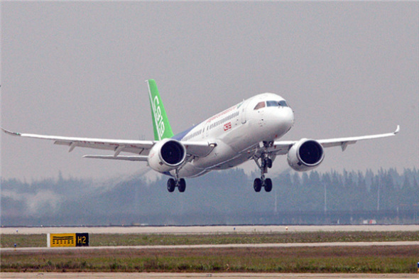 The COMAC C919, China's first domestically produced large passenger aircraft, made its maiden flight at Shanghai Pudong International Airport in May. Photo/Xinhua