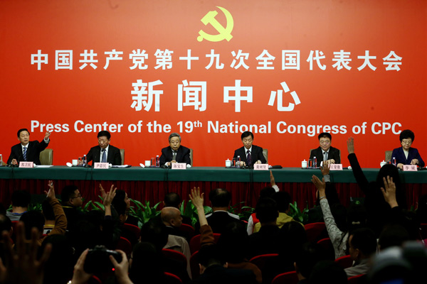 Central government officials take questions from reporters at a news conference about people's livelihoods on Sunday. They are, from left, Guo Weimin, vice-minister of the State Council Information Office; Yin Weimin, minister of human resources and social security; Chen Baosheng, minister of education; Huang Shuxian, minister of civil affairs; Wang Menghui, minister of housing and urban-rural development; and Li Bin, minister of the National Health and Family Planning Commission. (Photo by Edmond Tang/China Daily)