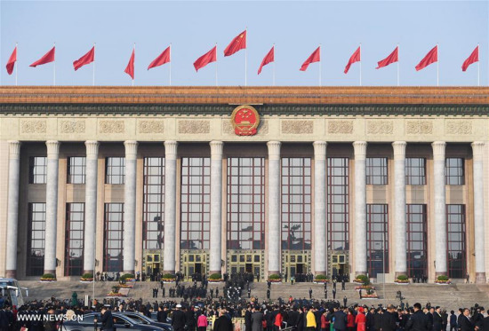 Delegates to the 19th National Congress of the Communist Party of China (CPC) walk to the Great Hall of the People in Beijing, capital of China, Oct. 24, 2017. The congress will close on Tuesday. (Xinhua/Shen Hong)