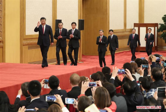Xi Jinping, general secretary of the Central Committee of the Communist Party of China (CPC), and the other newly-elected members of the Standing Committee of the Political Bureau of the 19th CPC Central Committee Li Keqiang, Li Zhanshu, Wang Yang, Wang Huning, Zhao Leji and Han Zheng arrive to meet the press at the Great Hall of the People in Beijing, capital of China, Oct. 25, 2017. (Xinhua/Ma Zhancheng)
