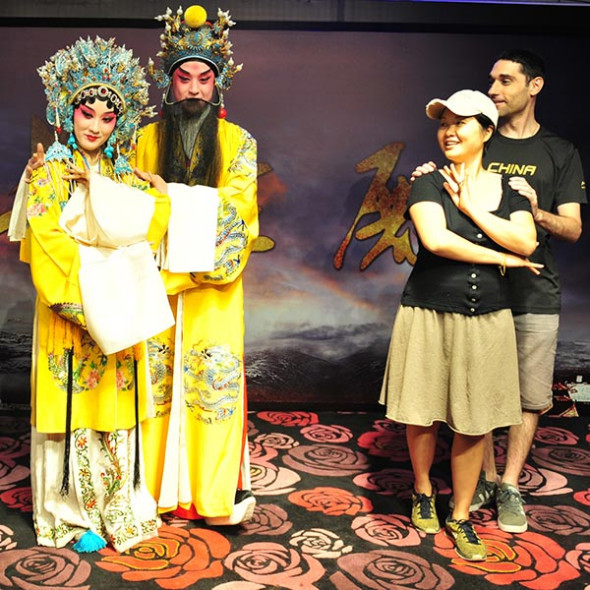 Performers from the Shanghai Kunqu Opera Troupe interact with people in Tianzifang, one of Shanghai's most visited spots, to promote the traditional Chinese art form.  (Photo provided to China Daily)