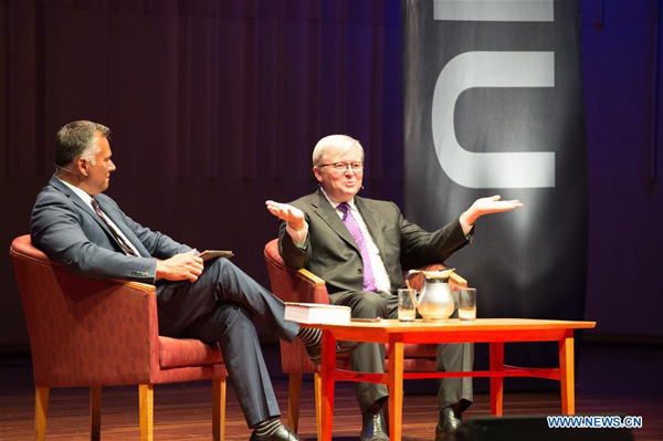 Former Australian Prime Minister Kevin Rudd (R) reacts in a public talk in the promoting of his autobiography, Not for the Faint-Hearted, at Australian National University in Canberra, Australia on Oct 27, 2017. (Photo/Xinhua)