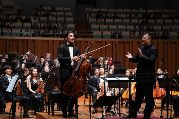 Chinese pipa player Wu Man and French cellist Gautier Capucon are touring with the NCPA Orchestra in North America. (Photo provided to China Daily)