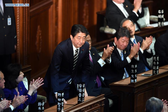 Shinzo Abe(3rd L), leader of the Liberal Democratic Party (LDP), bows as he is re-elected as prime minister, in Tokyo, Japan, on Nov. 1, 2017. Shinzo Abe was reelected as Japan's prime minister on Wednesday in both chambers of parliament. (Xinhua/Ma Ping)