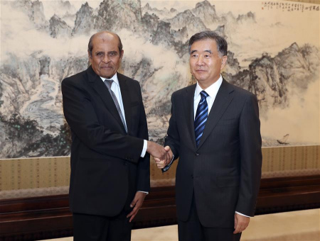 Chinese Vice Premier Wang Yang (R), also member of the Standing Committee of the Political Bureau of the Communist Party of China (CPC) Central Committee, meets with visiting Sri Lankan Foreign Minister Tilak Marapana in Beijing, capital of China, Nov. 1, 2017. (Xinhua/Ma Zhancheng)