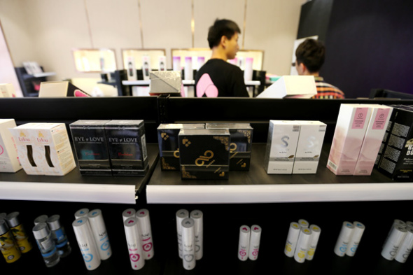 Customers shop at Beijing Lulu in the capital. The company has 150 stores around China, providing condoms, sex toys and erotic underwear. (Photo by Wang Zhuangfei/China Daily)