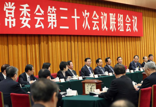 Zhang Dejiang, chairman of the National People's Congress (NPC) Standing Committee, presides over an inquiry with officials of the State Council on the enforcement of the Solid Waste Control Law, following panel discussions on the same topic, in Beijing, capital of China, Nov. 2, 2017. (Xinhua/Liu Weibing)