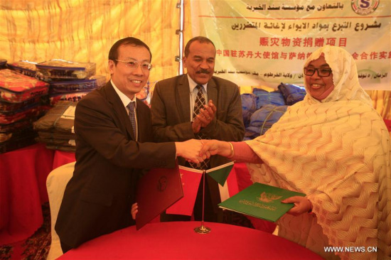 Chinese Ambassador to Sudan Li Lianhe (L) attends a signing ceremony in Khartoum, Sudan, Nov. 5, 2017. The Chinese Embassy in Khartoum on Sunday launched a joint project with a local non-governmental organization (NGO) for distributing shelter materials to about 1,000 families affected by recent rains and floods in Sudan. (Xinhua/Mohamed Khidi)