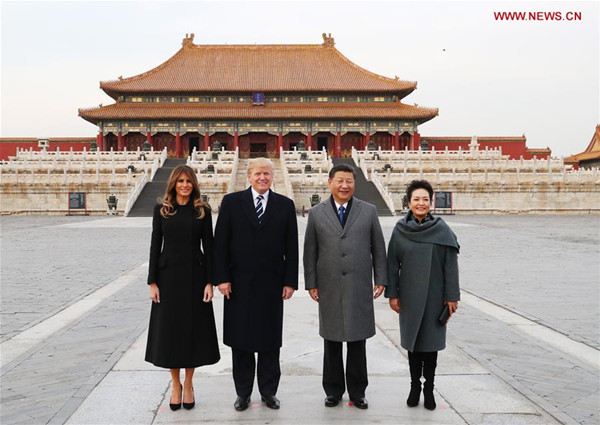 Chinese President Xi Jinping (2nd R) and his wife Peng Liyuan (1st R), and U.S. President Donald Trump (2nd L) and his wife Melania Trump pose for a photo in front of Taihedian, the Hall of Supreme Harmony, during their visit to the Palace Museum, or the Forbidden City, in Beijing, capital of China, Nov. 8, 2017. (Xinhua/Xie Huanchi)
