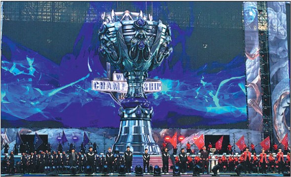 E-sports players pose on stage at the League of Legends World Championship at Bird's Nest stadium in Beijing on Saturdaythe first time China has hosted the premier gaming tournament. The Samsung Galaxy team defeated SK Telecom T1 3-0 in an all-Korean final to lift the trophy. (Photo provided to China Daily)