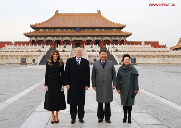 President Xi Jinping and his wife, Peng Liyuan, and U.S. President Donald Trump and his wife, Melania Trump, pose for a photo in front of the Hall of Supreme Harmony during their visit to the Palace Museum, or the Forbidden City, in Beijing on Wednesday. (Photo: Xinhua/Lan Hongguang)