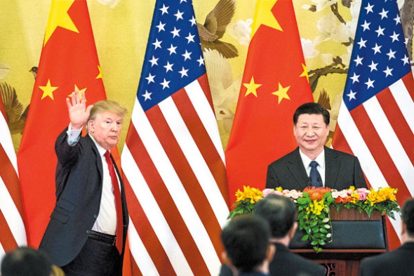 President Xi Jinping and U.S. President Donald Trump speak to reporters at the Great Hall of the People in Beijing on Thursday. (XU JINGXING / CHINA DAILY)