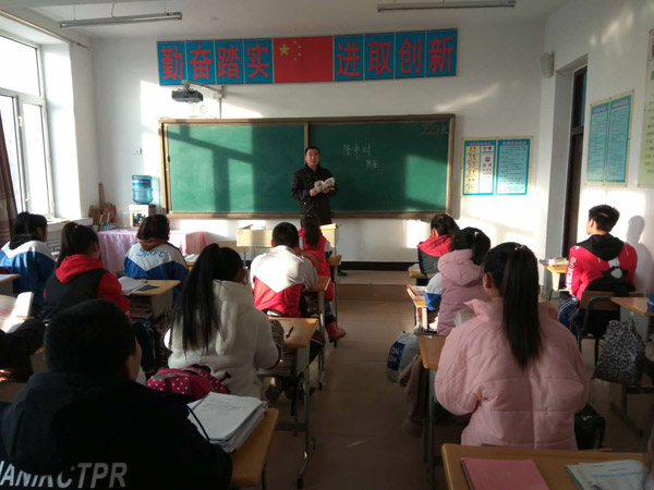 He Chunyu, 44, at Lingshan Township Middle School in Wangkui county, Northeast China's Heilongjiang Province. (Photo provided to China Daily)