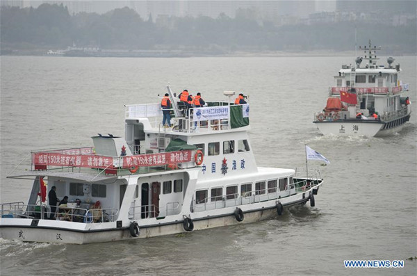 Two scientific survey ships leave for the upper reaches of the Yangtze River from Wuhan in central China's Hubei Province on Nov. 10, 2017. China on Friday launched its first survey of endangered finless porpoises in five years, to monitor their living conditions in moves to better rehabilitate their habitat in the Yangtze River. (Xinhua/Xiong Qi)