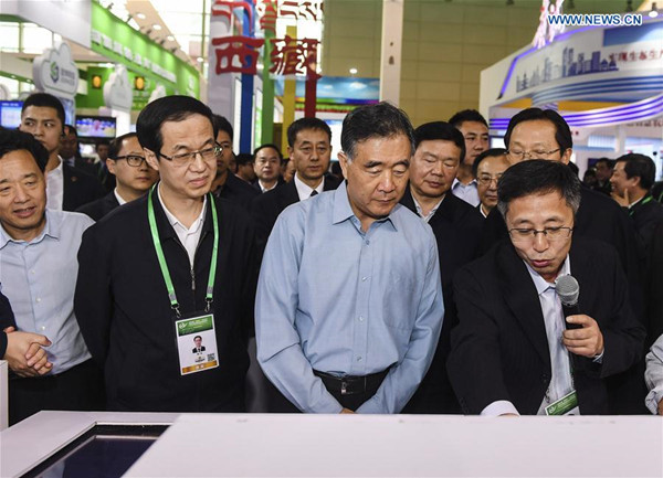 Chinese Vice Premier Wang Yang (2nd R, front), also a member of the Standing Committee of the Political Bureau of the Communist Party of China Central Committee, visits an expo before a meeting on farmers' entrepreneurship and innovation in Suzhou, east China's Jiangsu Province, Nov. 10, 2017. (Xinhua/Ji Chunpeng)