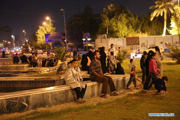 People gather outdoor in Baghdad, Iraq, on Nov. 12, 2017. A huge earthquake hit Iraq's northern province of Sulaimaniyah on Sunday, killing four people and injuring 50 others, according to the Kurdish Rudaw newsite. The earthquake was felt in many Iraqi provinces in the north and central regions, including the Iraqi capital Baghdad, witnesses said. (Xinhua/Khalil Dawood)