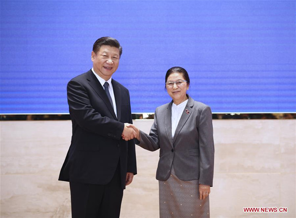 Chinese President Xi Jinping (L), also general secretary of the Communist Party of China Central Committee, shakes hands with President of the Lao National Assembly Pany Yathotu during their meeting in Vientiane, Laos, Nov. 14, 2017. (Xinhua/Lan Hongguang)