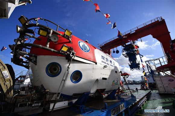 The manned submersible named Shenhai Yongshi, or deepsea warrior, on board the ship Tansuo-1 arrives at port in Sanya, south China's Hainan Province, Oct. 3, 2017.  (Xinhua/Sha Xiaofeng)