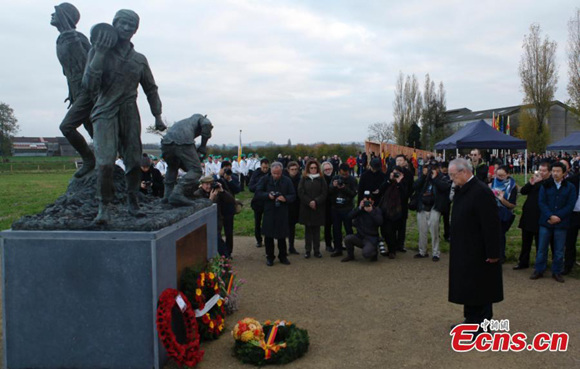 On a chilly and rainy day in the Flanders Fields, a group of young Chinese who rested in an almost forgotten part of World War I history for the past 100 years, finally got the respect and honor they deserved.