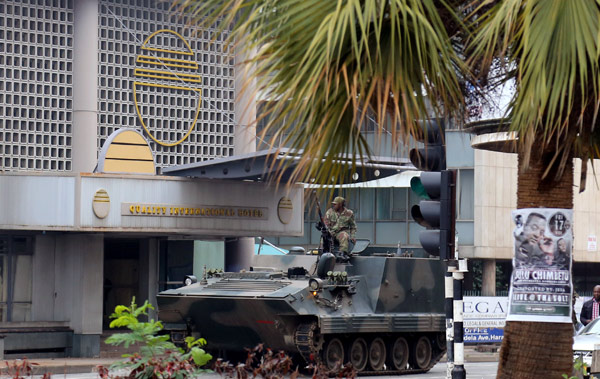 An armored personnel carrier patrols the streets of Harare, capital of Zimbabwe, on Wednesday. China's Foreign Ministry has said it is monitoring the situation.(Photo/Xinhua)